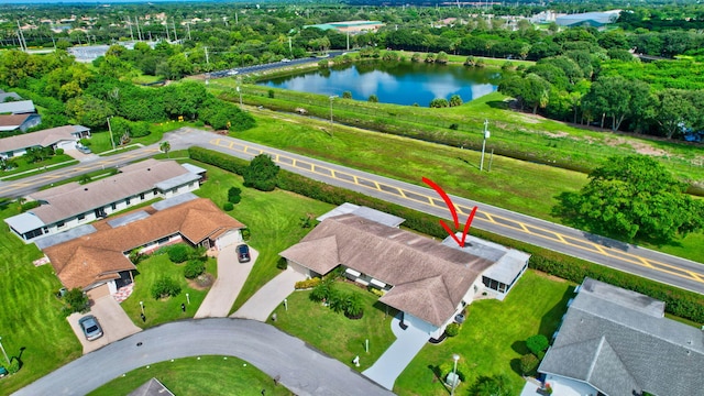 birds eye view of property featuring a water view