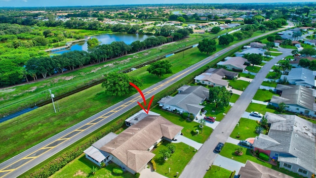 birds eye view of property featuring a water view