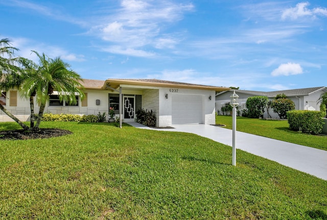 ranch-style house featuring a front yard and a garage