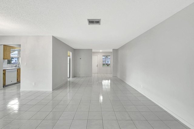 6237 Overland Pl, Delray Beach, FL 33484 - unfurnished room with a textured ceiling, visible vents, and light tile patterned floors