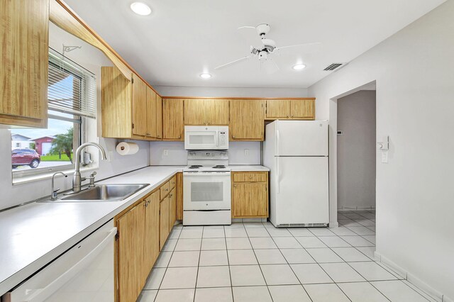 kitchen featuring ceiling fan, white appliances, sink, and light tile patterned floors