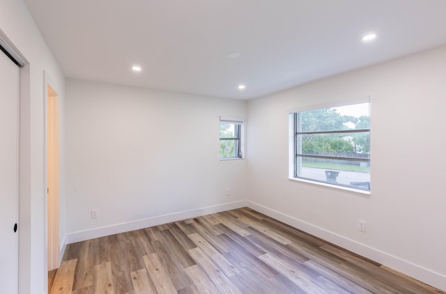 unfurnished bedroom with light wood-type flooring