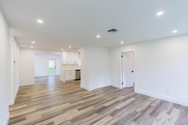 unfurnished living room with light wood-type flooring