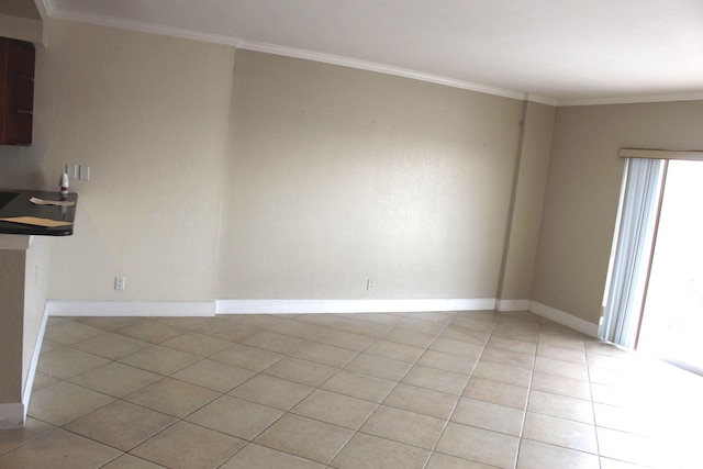 unfurnished dining area featuring crown molding and light tile patterned flooring