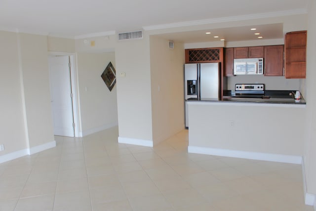 kitchen with ornamental molding, appliances with stainless steel finishes, kitchen peninsula, and light tile patterned flooring