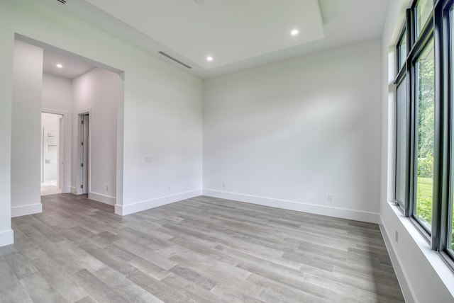 unfurnished room with light hardwood / wood-style flooring