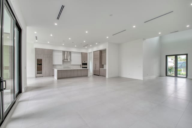 unfurnished living room with french doors