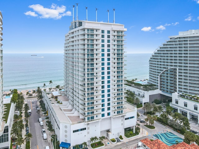 aerial view featuring a view of the beach and a water view