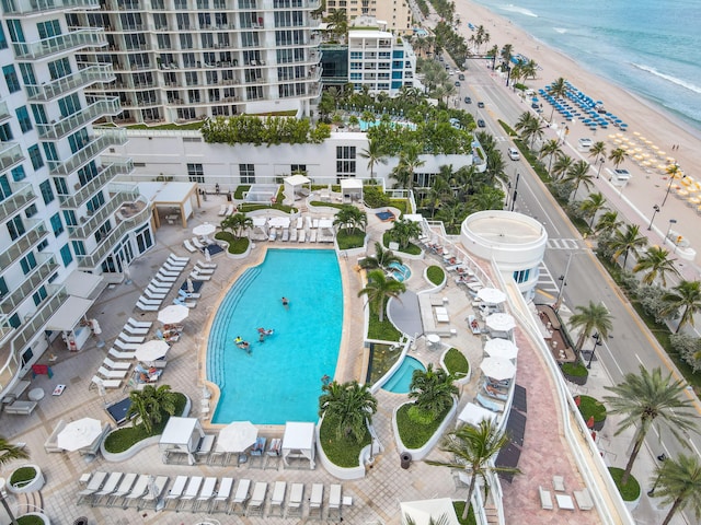 bird's eye view featuring a water view and a view of the beach