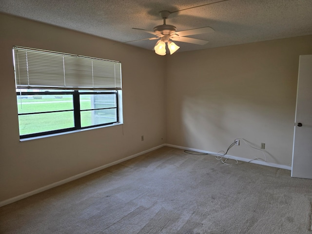 unfurnished room with light carpet, a textured ceiling, and ceiling fan