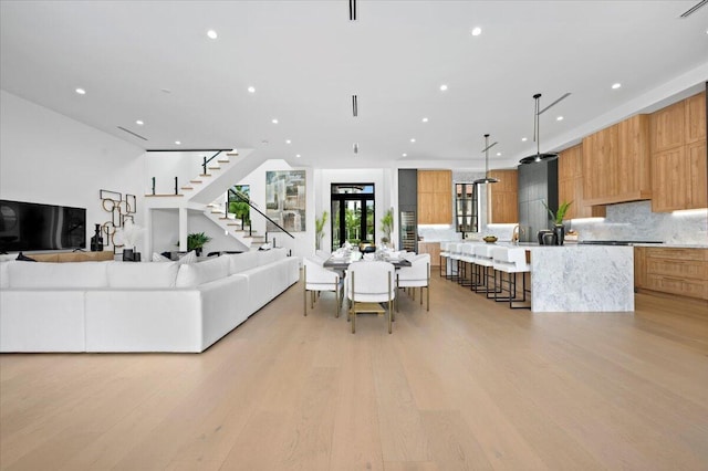 living room with light hardwood / wood-style flooring