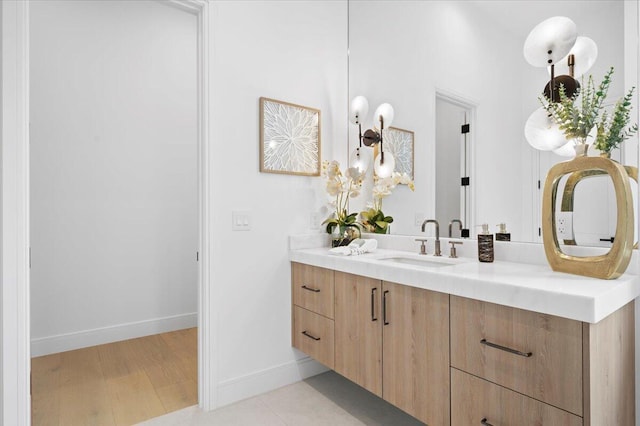 bathroom with vanity and hardwood / wood-style flooring