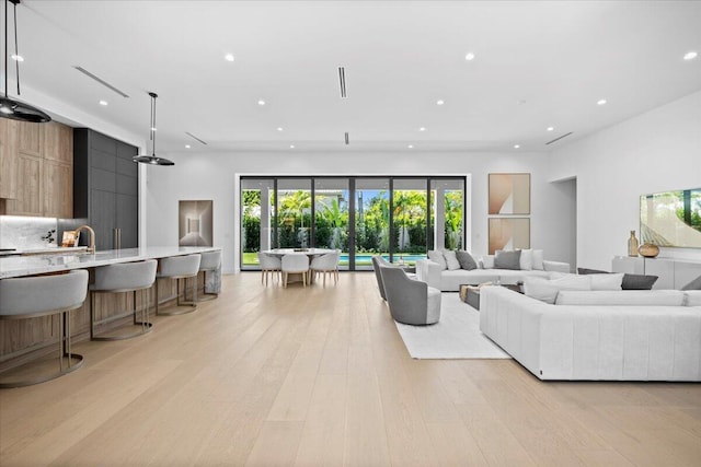 224 Edmor Rd, West Palm Beach, FL 33405 - living area featuring recessed lighting and light wood-style flooring