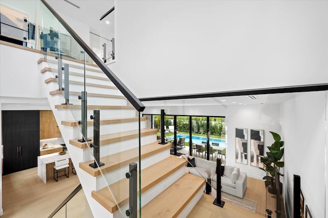 stairway featuring hardwood / wood-style flooring