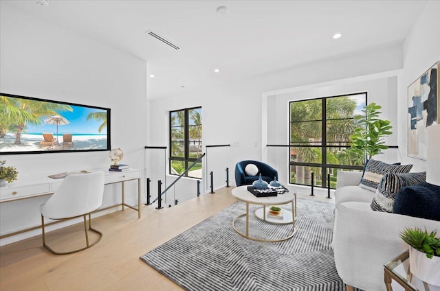 living room with light hardwood / wood-style flooring