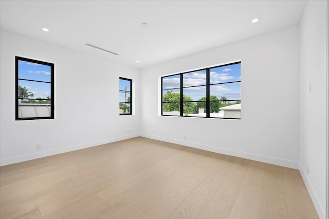 spare room with light wood-type flooring