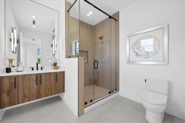 224 Edmor Rd, West Palm Beach, FL 33405 - bathroom featuring a shower stall, baseboards, toilet, vanity, and tile patterned flooring