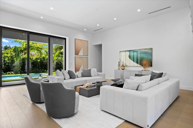 224 Edmor Rd, West Palm Beach, FL 33405 - living room featuring wood finished floors, recessed lighting, and baseboards