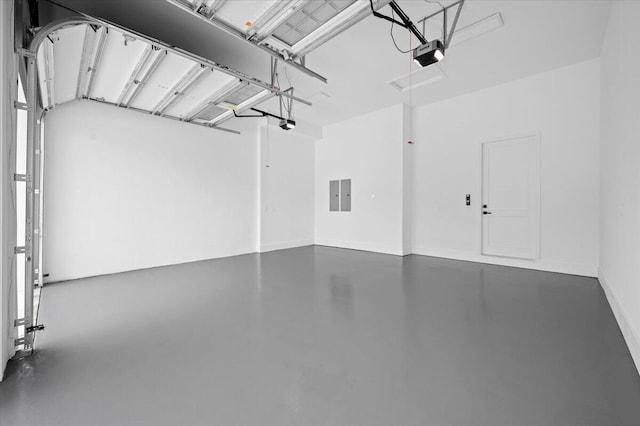 224 Edmor Rd, West Palm Beach, FL 33405 - garage featuring a garage door opener and electric panel