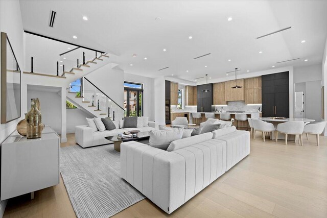 224 Edmor Rd, West Palm Beach, FL 33405 - living room featuring stairway, light wood-style floors, and recessed lighting