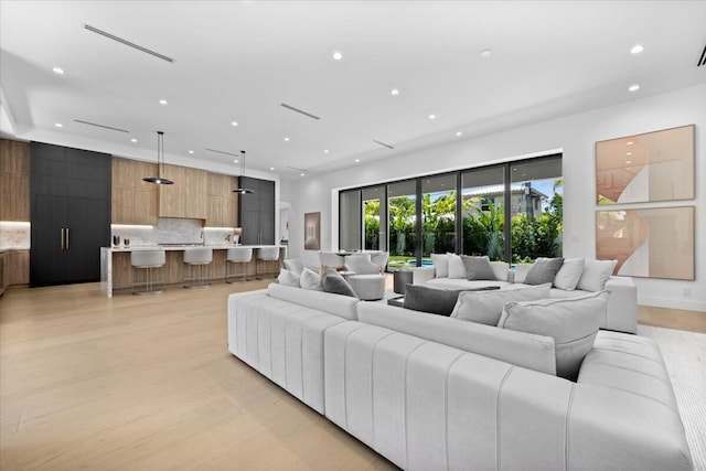 224 Edmor Rd, West Palm Beach, FL 33405 - living room with recessed lighting and light wood-type flooring