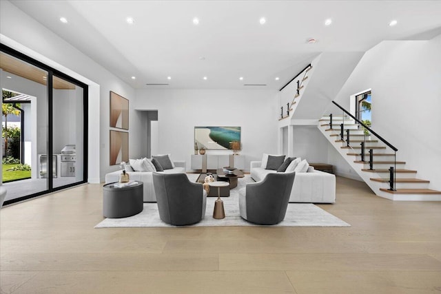 224 Edmor Rd, West Palm Beach, FL 33405 - living area featuring stairway, wood finished floors, recessed lighting, and built in features