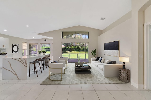 living room with visible vents, recessed lighting, baseboards, light tile patterned flooring, and lofted ceiling