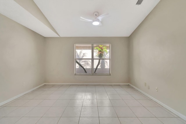 empty room featuring visible vents, a ceiling fan, baseboards, and lofted ceiling