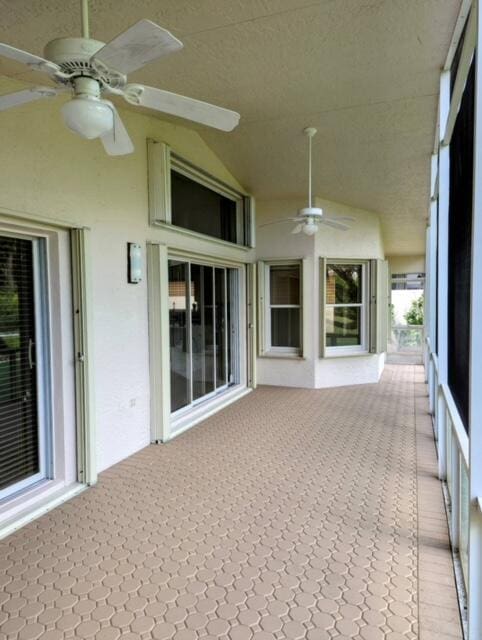 unfurnished sunroom with lofted ceiling