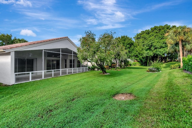 view of yard with a sunroom