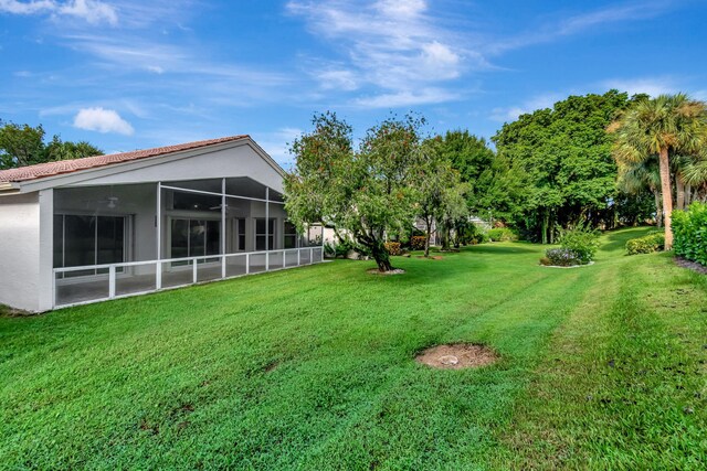 7893 Stanza St, Boynton Beach, FL 33437 - view of grassy yard with a sunroom