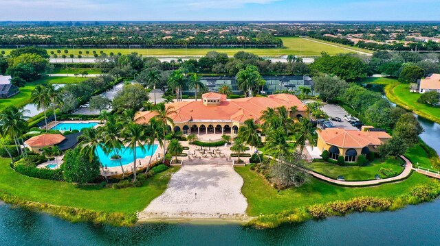 7893 Stanza St, Boynton Beach, FL 33437 - aerial view of a pool area, a nearby body of water, and a tree filled landscape