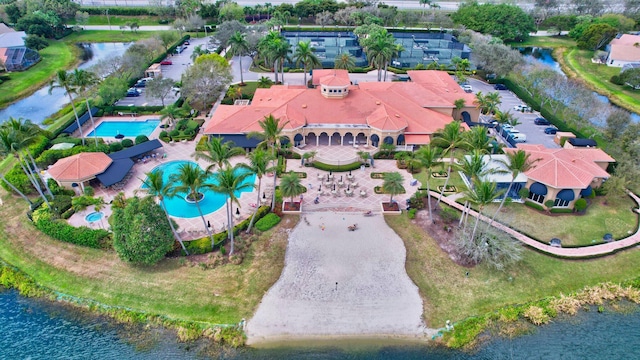 birds eye view of property with a water view