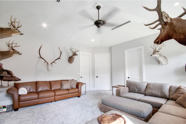 living room with light colored carpet and ceiling fan