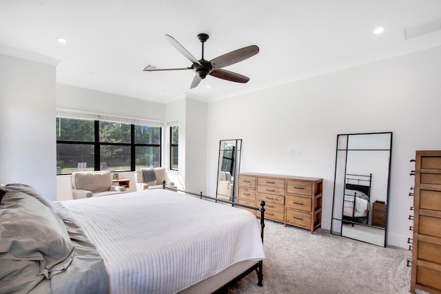 bedroom featuring ceiling fan, light carpet, and ornamental molding