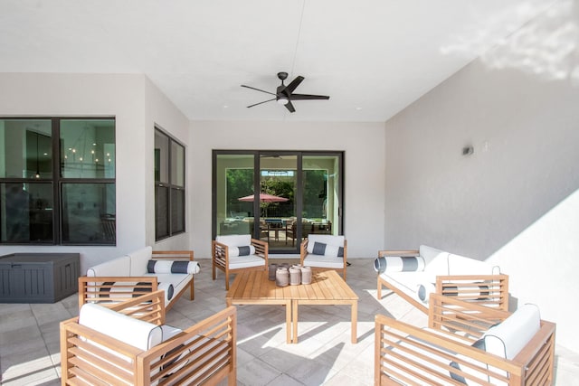 view of patio with ceiling fan and an outdoor hangout area