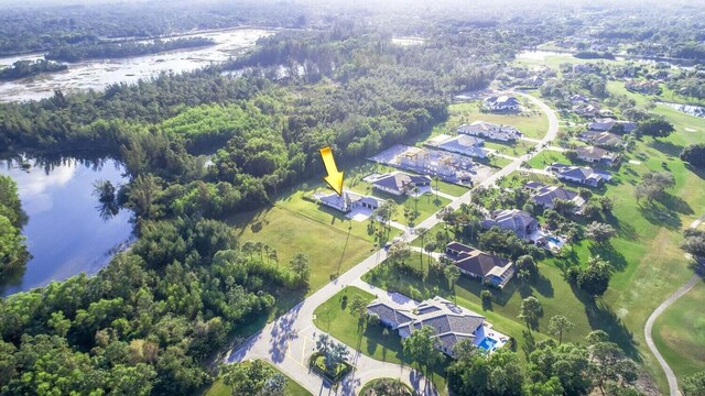 birds eye view of property featuring a water view