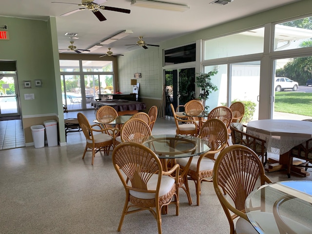 dining space with ceiling fan and plenty of natural light