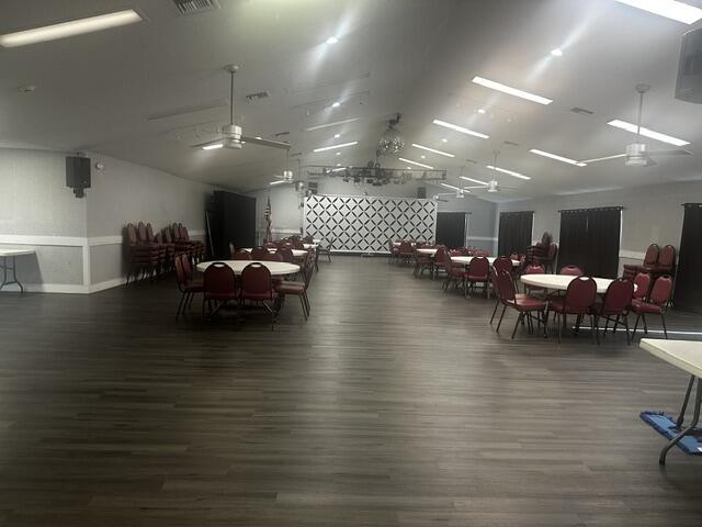 dining area with dark hardwood / wood-style floors and ceiling fan