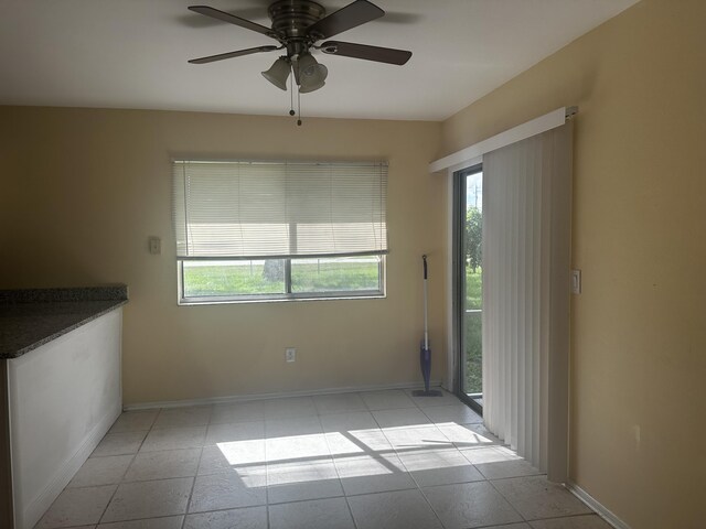 unfurnished room with ceiling fan