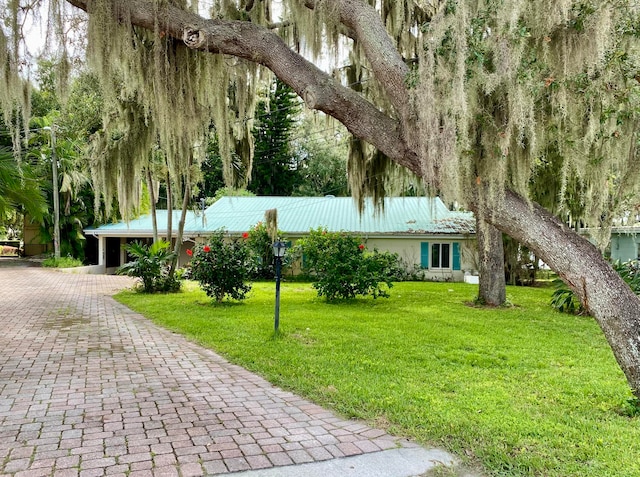 surrounding community featuring a lawn