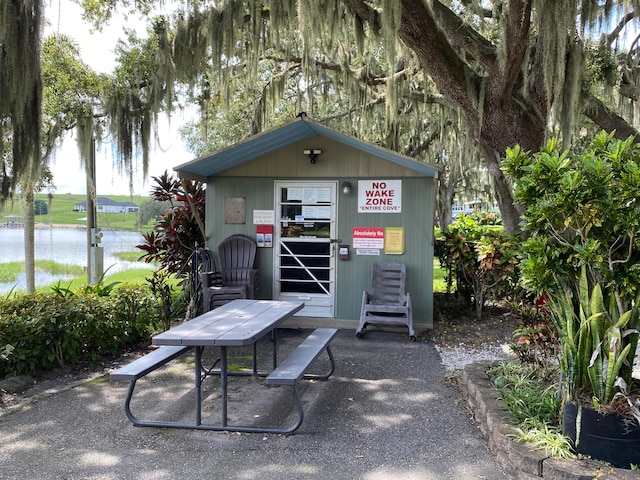 view of outbuilding with a water view