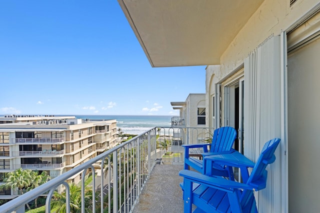 balcony featuring a water view