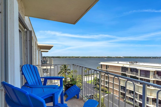 balcony featuring a water view