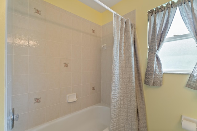 bathroom featuring shower / tub combo with curtain