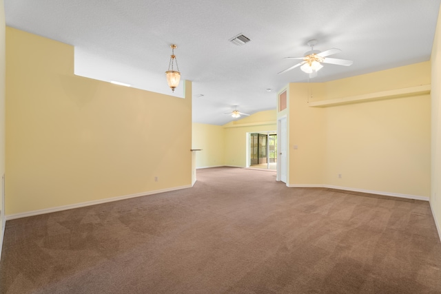 carpeted spare room with lofted ceiling and ceiling fan