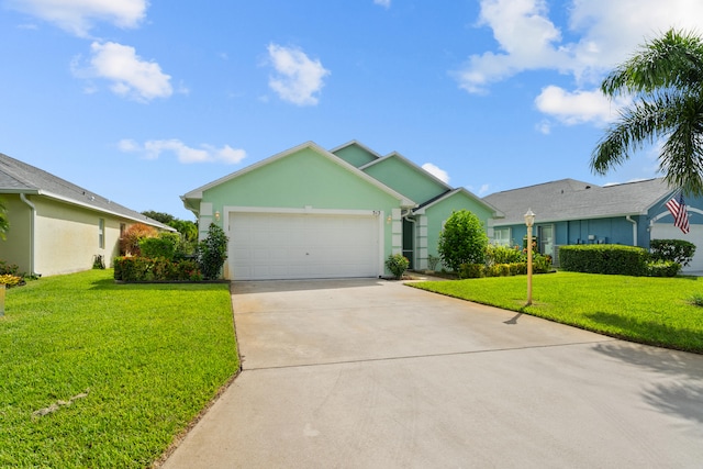 ranch-style home with a garage and a front lawn