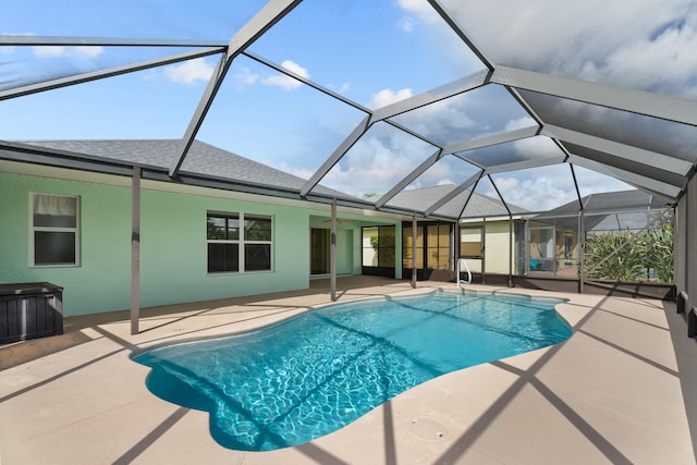 view of pool with a lanai and a patio