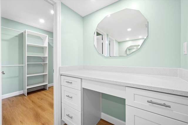 bathroom featuring vanity and wood-type flooring