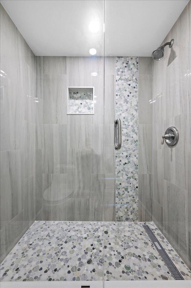 bathroom featuring an enclosed shower